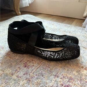 Elegant black lac ballet flats. Adorable cross around the ankle. Gently worn.